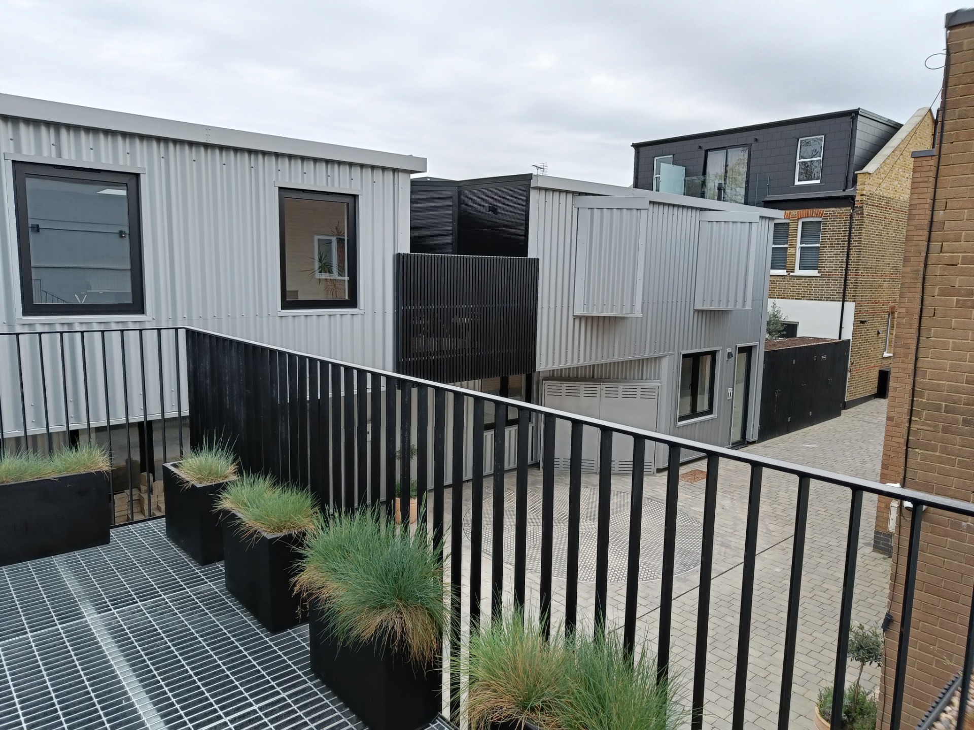 Beckenham: Conversion and extension of industrial buildings for use as residential flats, with SorghumBirch